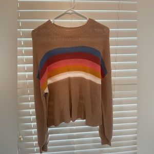 tan sweater with colorful stripes